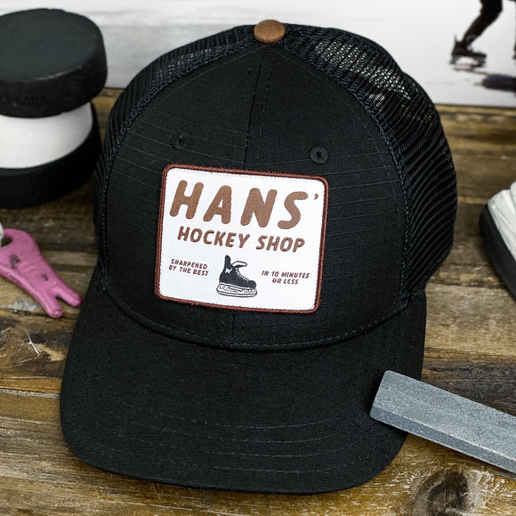 Hans' Hockey Shop (Black/Whiskey) Beauty Status Hockey Co.