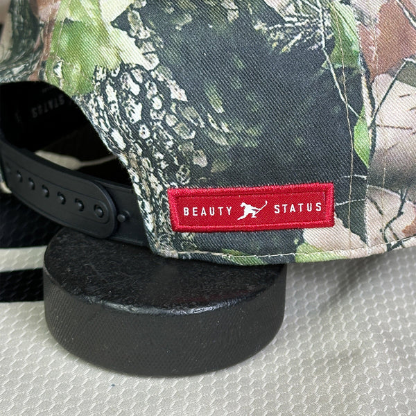 Ice Cold (Woodland Camo) Beauty Status Hockey Co.