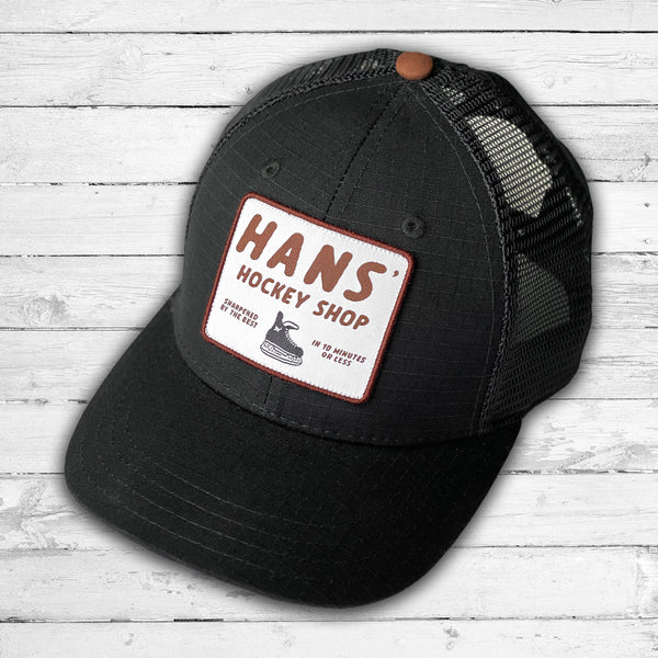 Hans' Hockey Shop (Black/Whiskey) Beauty Status Hockey Co.